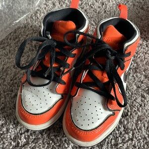 Orange and black toddler Jordan 1s